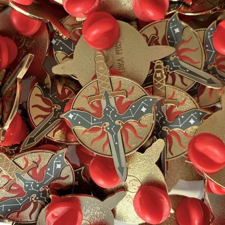 A close up shot of the pin shows the 3D effect achieved by the recessed metal.