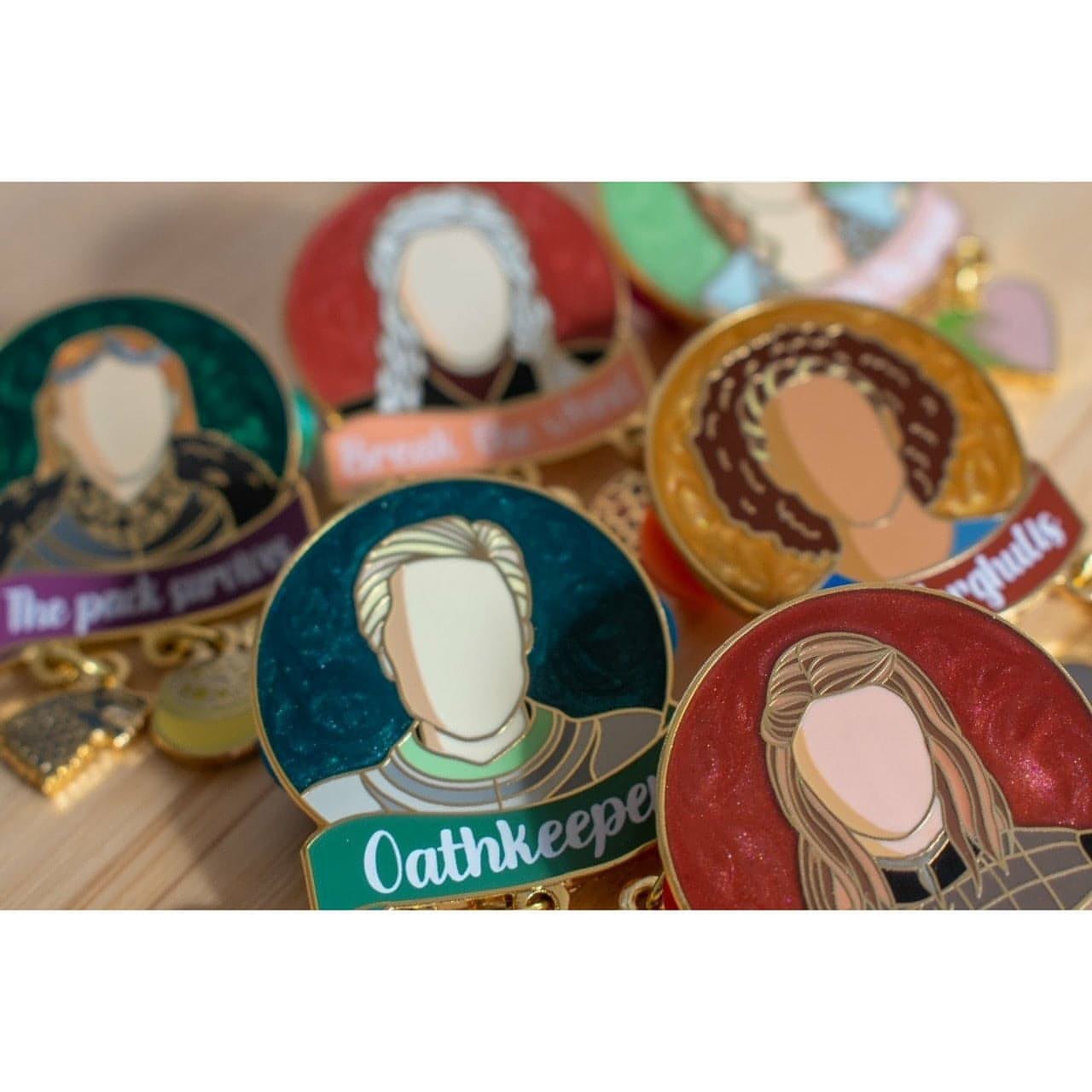 The image shows a close up of some Women of Westeros pins.