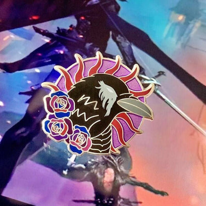 This is another photo of the same pin but with the background of some Dragon Age concept art which features an Antivan Crow character.